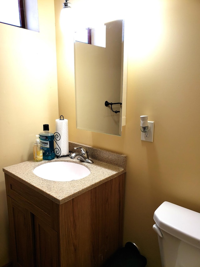 bathroom with vanity and toilet