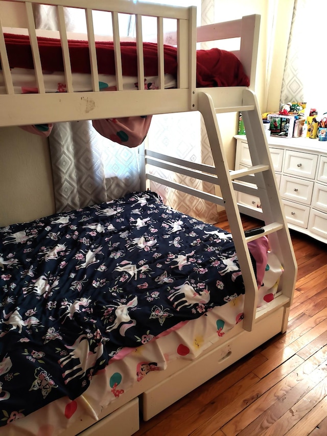 bedroom with wood-type flooring