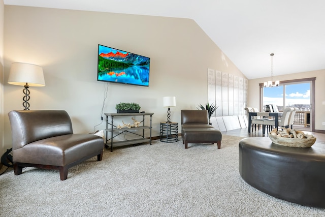 carpeted living room featuring high vaulted ceiling and an inviting chandelier