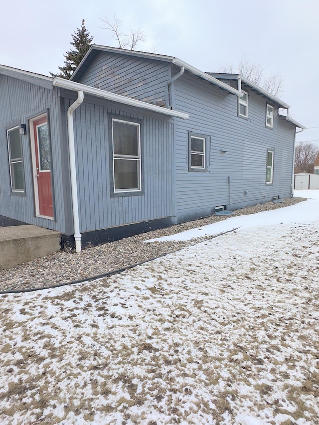 view of snow covered house