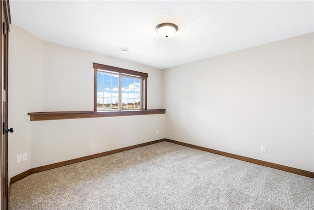 unfurnished room with carpet flooring