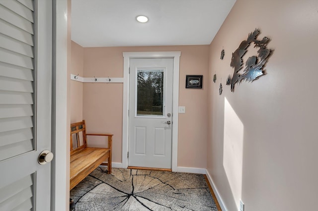 doorway to outside featuring recessed lighting and baseboards