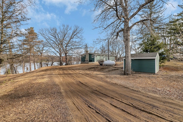 exterior space with an outbuilding and a shed