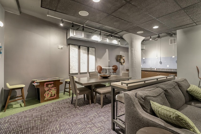 2929 Chicago Ave Unit 1216, Minneapolis, MN 55407 - carpeted dining area with rail lighting and baseboards