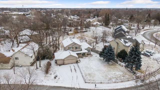 snowy aerial view featuring a residential view