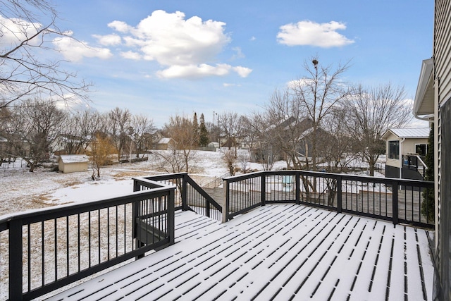 view of snow covered deck