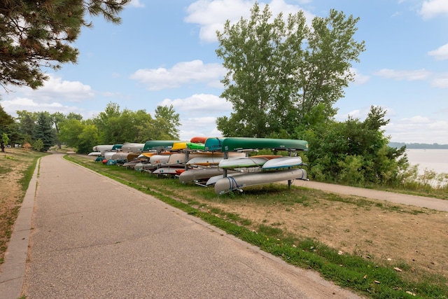 view of vehicle parking featuring a water view