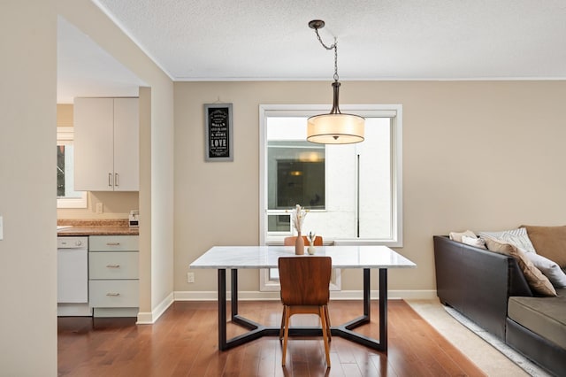 3054 Lake Shore Dr Unit B, Minneapolis, MN 55416 - dining area with hardwood / wood-style floors, crown molding, and baseboards