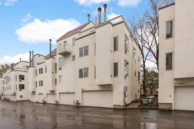 3054 Lake Shore Dr Unit B, Minneapolis, MN 55416 - view of building exterior featuring a garage