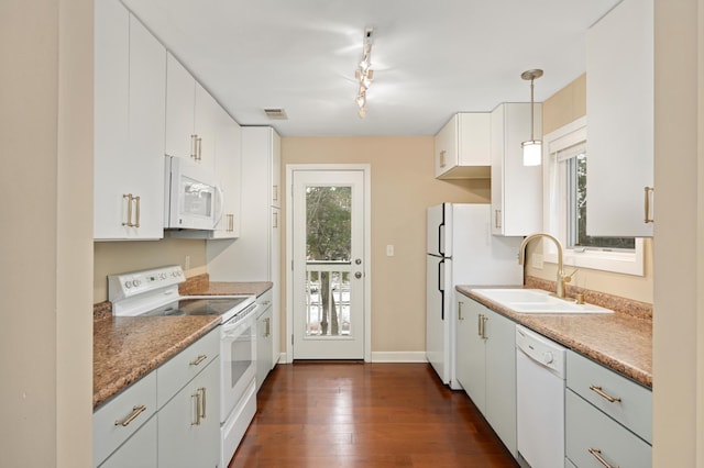 3054 Lake Shore Dr Unit B, Minneapolis, MN 55416 - kitchen featuring white appliances, decorative light fixtures, a sink, visible vents, and dark wood-type flooring
