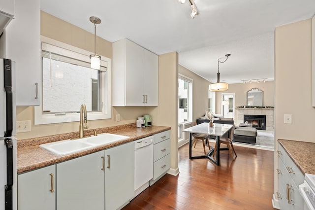 3054 Lake Shore Dr Unit B, Minneapolis, MN 55416 - kitchen with track lighting, white dishwasher, a sink, open floor plan, and dark wood-type flooring