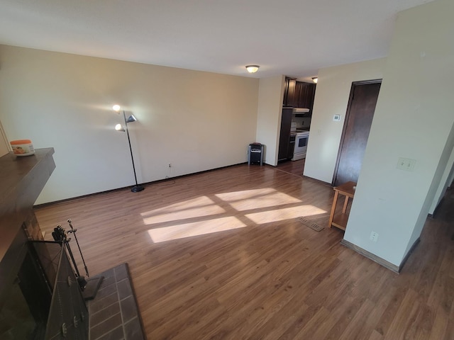 unfurnished living room with hardwood / wood-style flooring