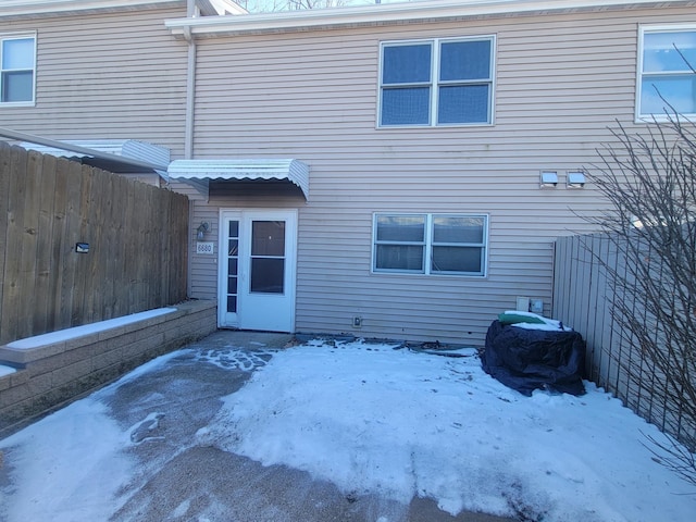 view of snow covered house