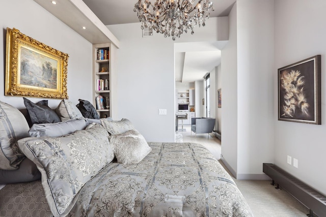 bedroom with a chandelier and carpet floors