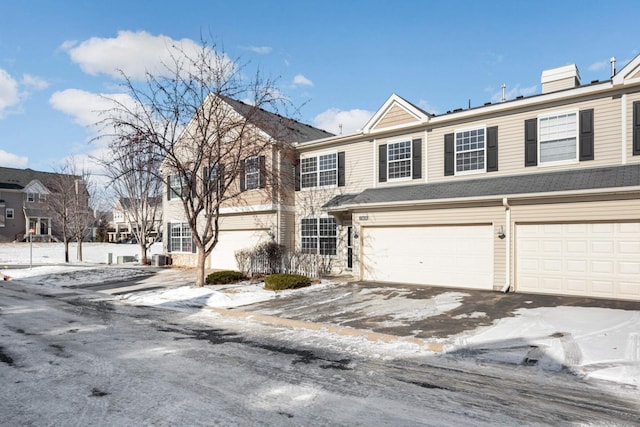 townhome / multi-family property featuring a garage