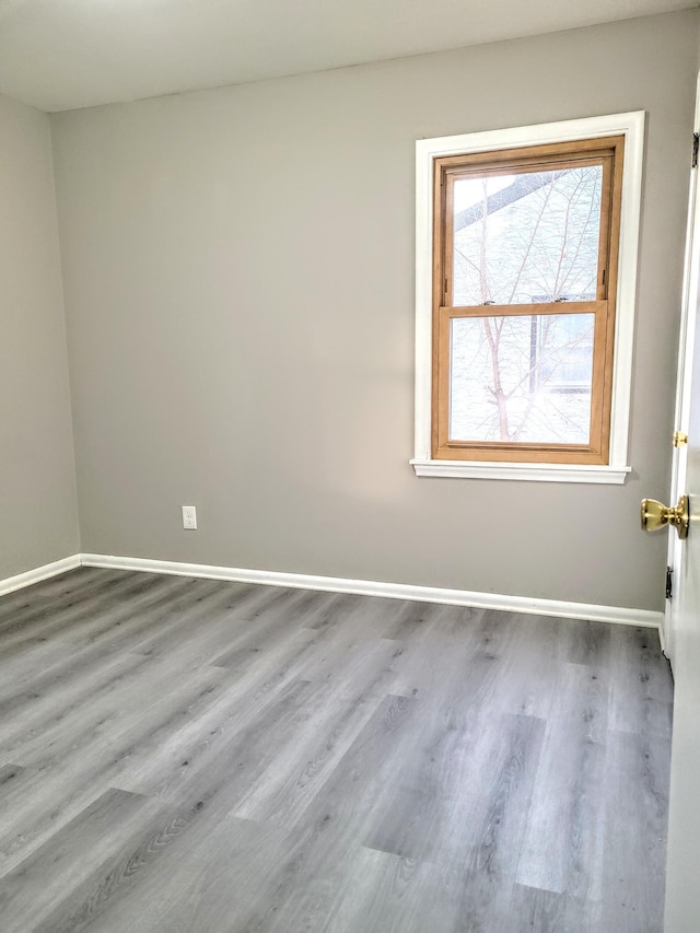 empty room featuring hardwood / wood-style floors