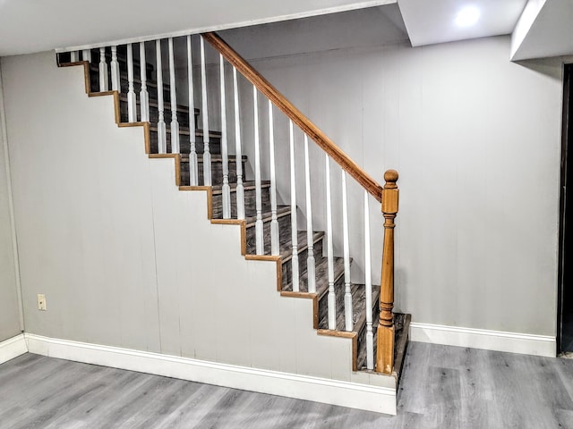 stairway with wood-type flooring