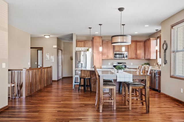 dining space with dark wood-style floors, recessed lighting, and baseboards