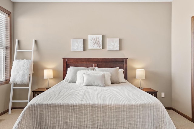 bedroom featuring baseboards and carpet floors