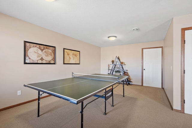 playroom featuring light colored carpet and baseboards