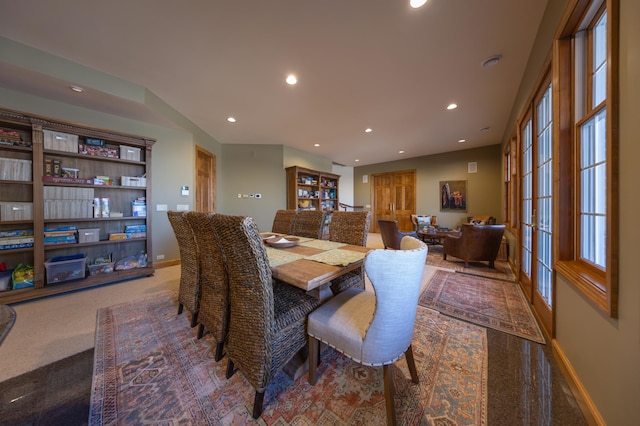 dining room featuring carpet flooring