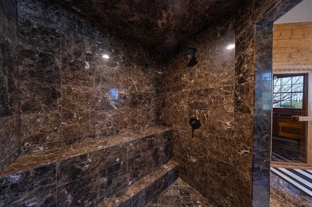 bathroom with tiled shower