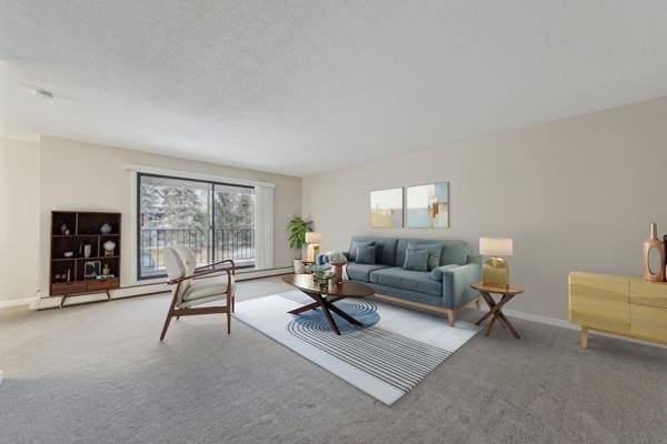 living room featuring carpet flooring and a textured ceiling