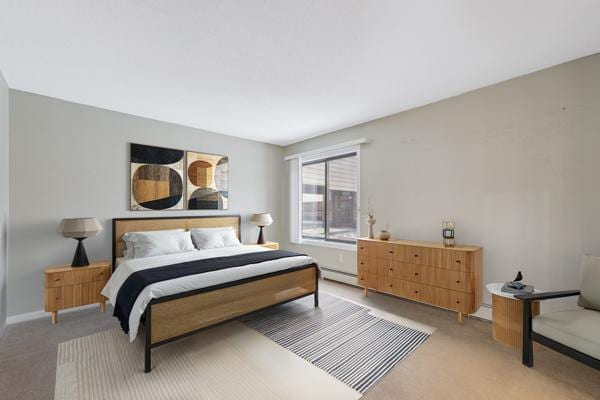 bedroom with a baseboard radiator and carpet flooring