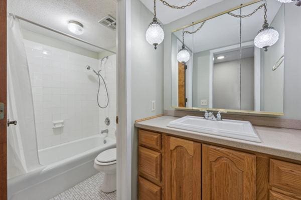 full bathroom with vanity, toilet, tile patterned flooring, and shower / bath combo with shower curtain