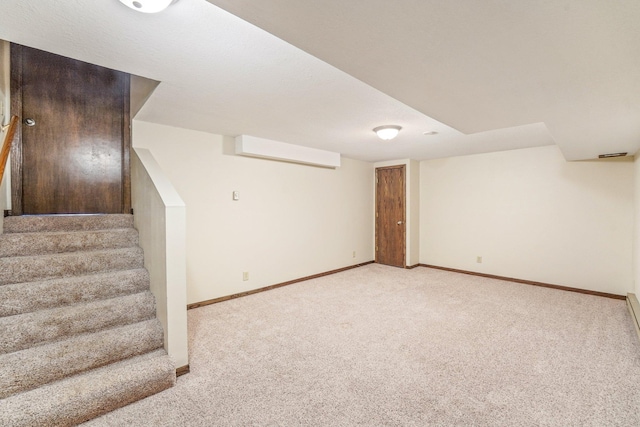 basement with light colored carpet