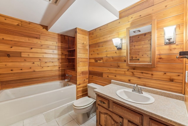 full bathroom featuring vanity, wooden walls, tile patterned floors, and toilet