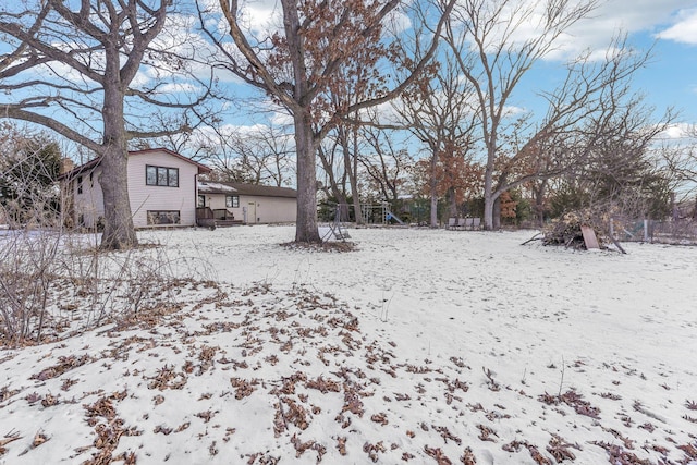 view of yard layered in snow