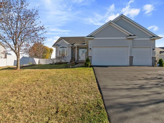 single story home featuring a garage, fence, driveway, and a front lawn