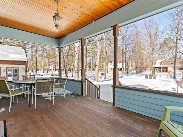 view of snow covered deck