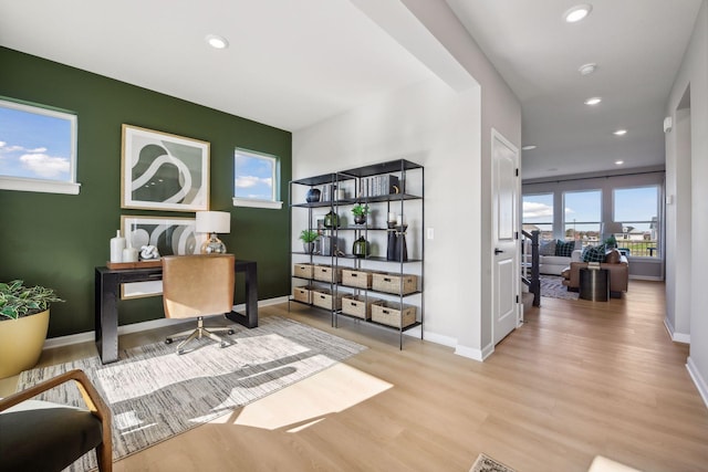 office space with light wood-type flooring