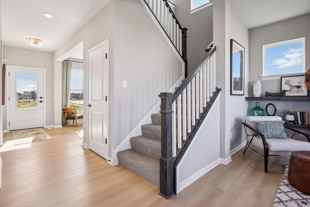 stairway featuring wood-type flooring