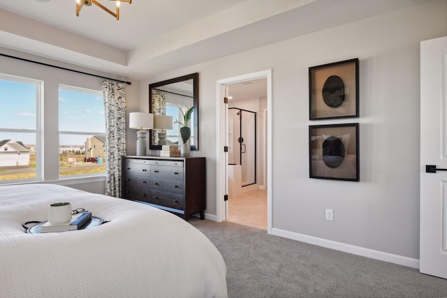 carpeted bedroom featuring a notable chandelier