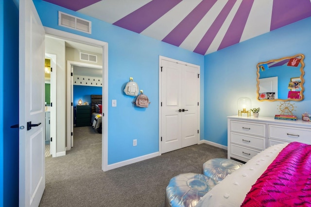 carpeted bedroom with lofted ceiling and a closet