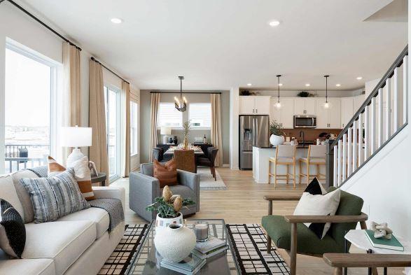 living room featuring light wood-type flooring and a chandelier