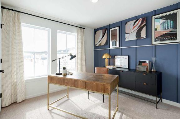 carpeted home office featuring a wealth of natural light