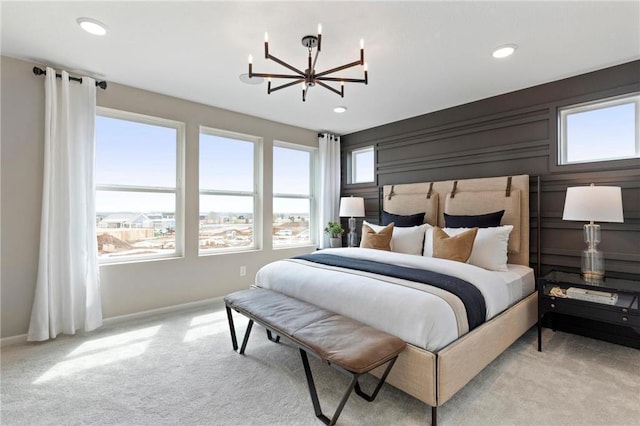 carpeted bedroom with a chandelier, recessed lighting, and baseboards