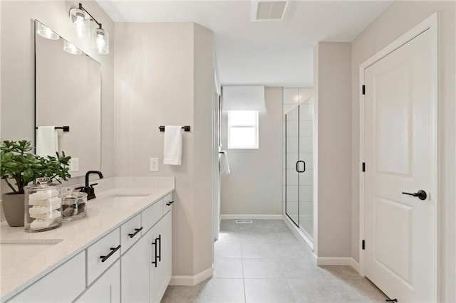 full bath featuring tile patterned flooring, a sink, visible vents, double vanity, and a stall shower