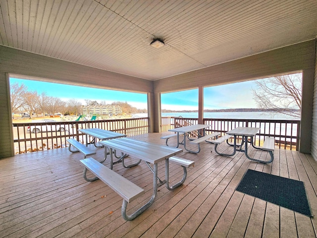 wooden terrace with a water view