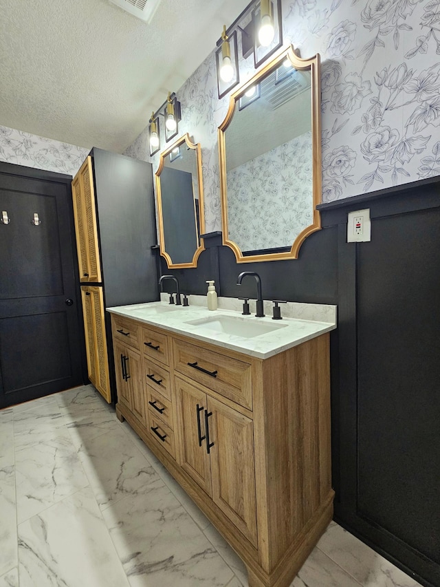 bathroom featuring vanity and a textured ceiling