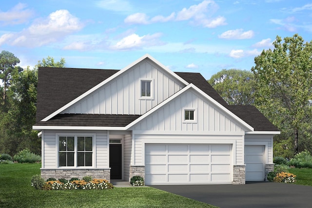 view of front of house featuring a garage and a front yard