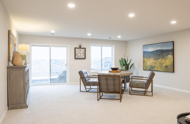 dining room with baseboards, recessed lighting, and light colored carpet