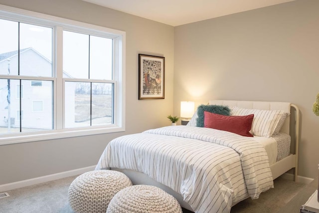 bedroom featuring carpet, visible vents, and baseboards