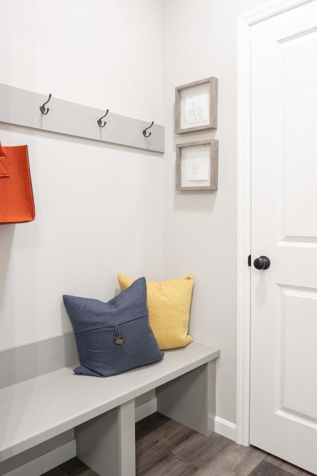 mudroom featuring wood finished floors and baseboards