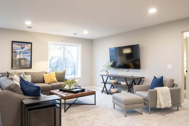 living room with baseboards, recessed lighting, and light colored carpet