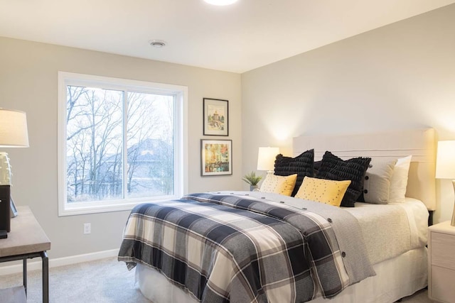 bedroom with visible vents, baseboards, and carpet flooring